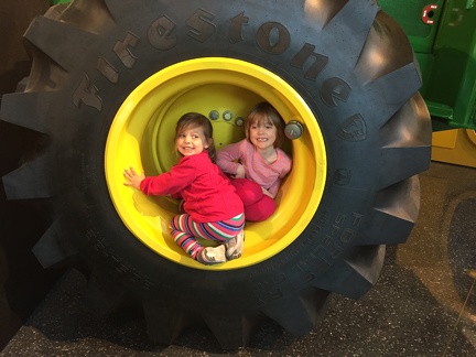 Greta and Amelia in a tire